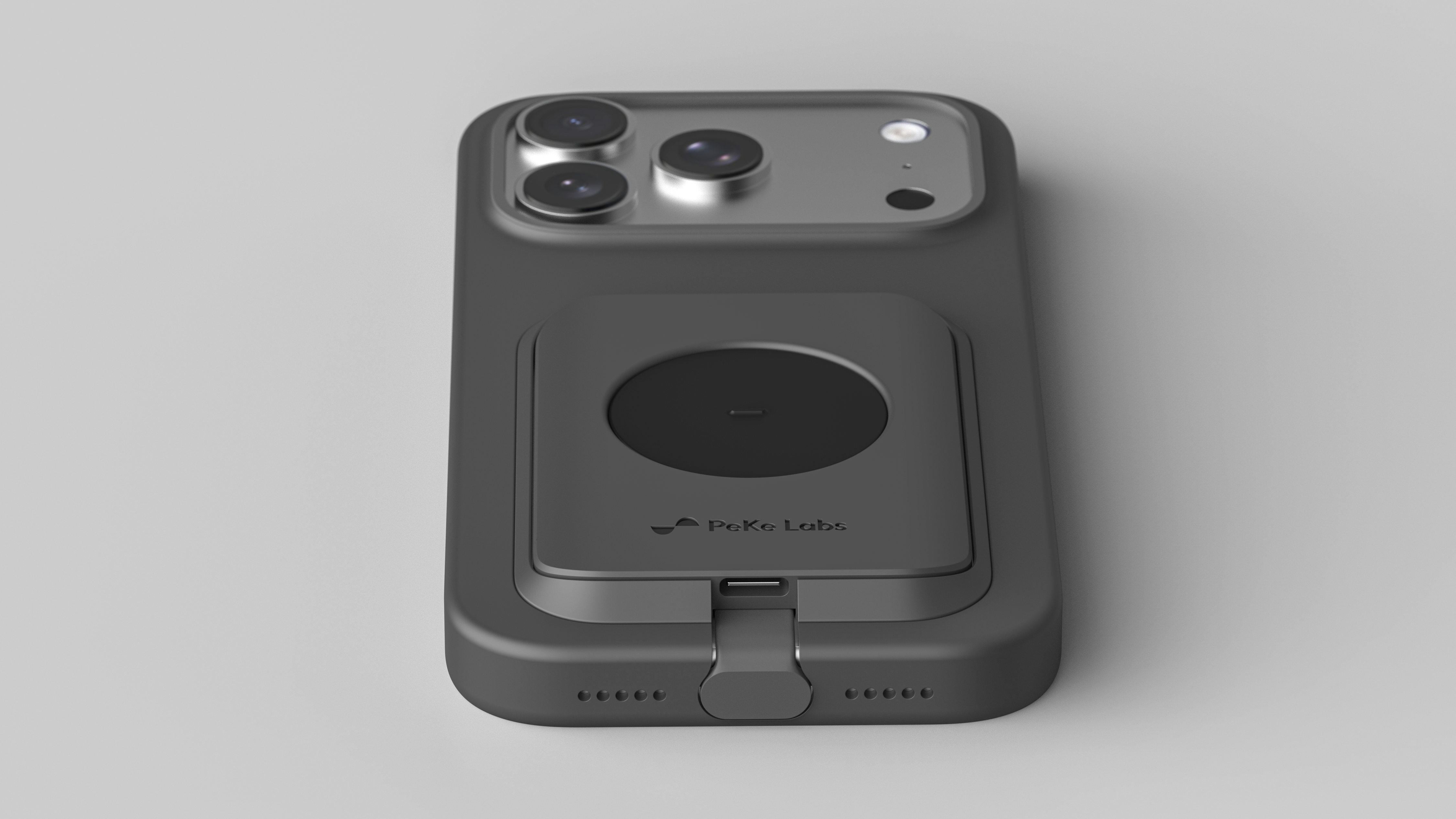 Close-up of the reference controller docked to the back of a phone, beside the camera array.